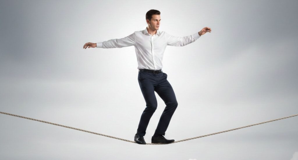 Professional balancing on a tightrope, symbolising success in 2026 where work-life balance, mental health, and sustainable career growth matter more than constant pressure.